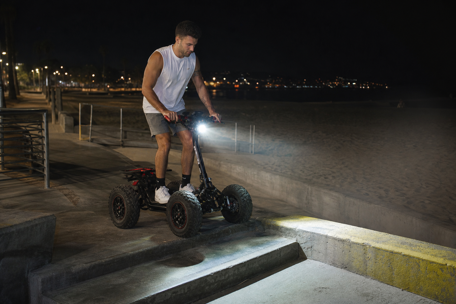 EZRaider-style vehicle navigating a beach access curb and ramp at night
